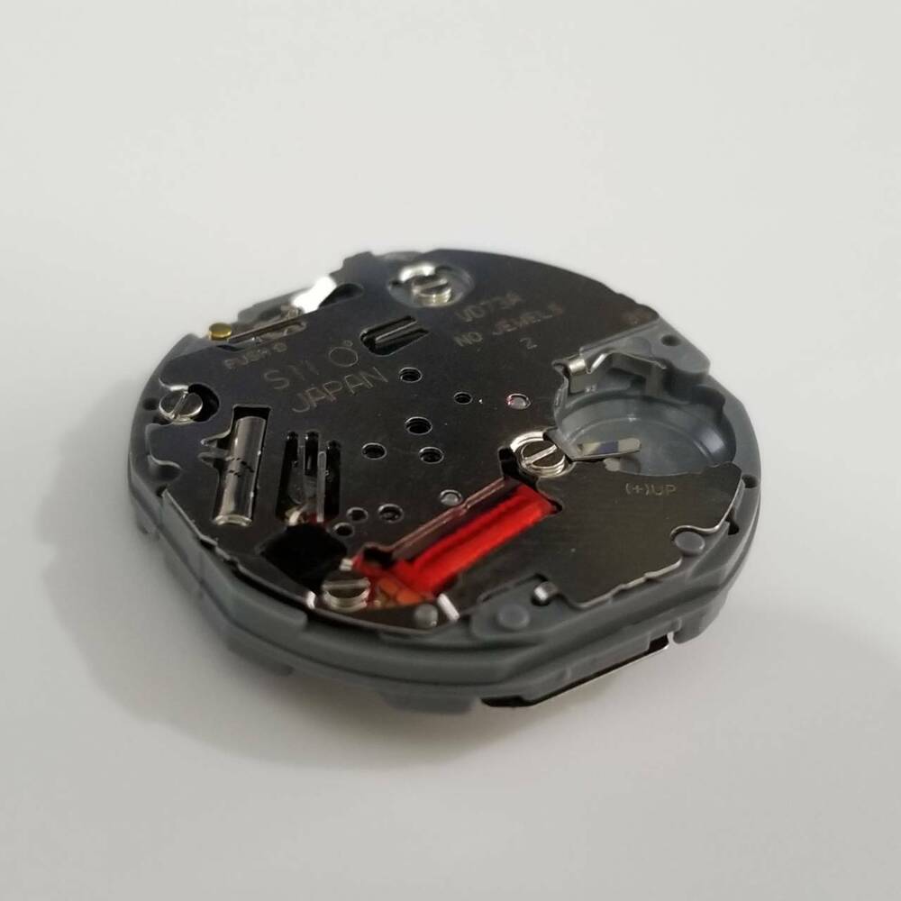 Hattori Epson TMI VD73A quartz watch movement showing precise Japanese craftsmanship for accurate repairs.