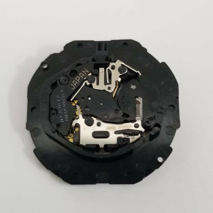 Hattori Epson TMI PC32 quartz watch movement with date display at 3 o'clock, precision Japan-made mechanism for watch repairs.