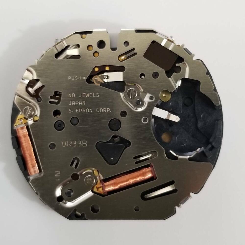 S. Epson VR33 quartz watch repair part, precise movement component ensuring accurate timekeeping performance.