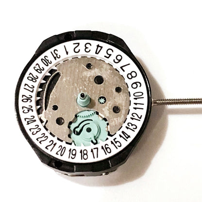 Sunon SL25 quartz watch movement with 3 hands and date display at 3 o'clock position.