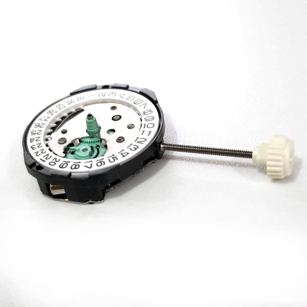 Sunon SL25 quartz watch movement featuring three hands and date display at 3 o'clock for precise timekeeping.