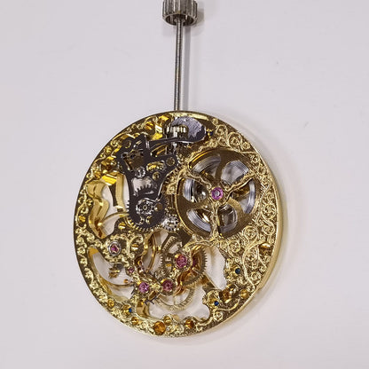 Seagull ST3600 mechanical watch movement with golden hollow design and side second hand at 9 o'clock.